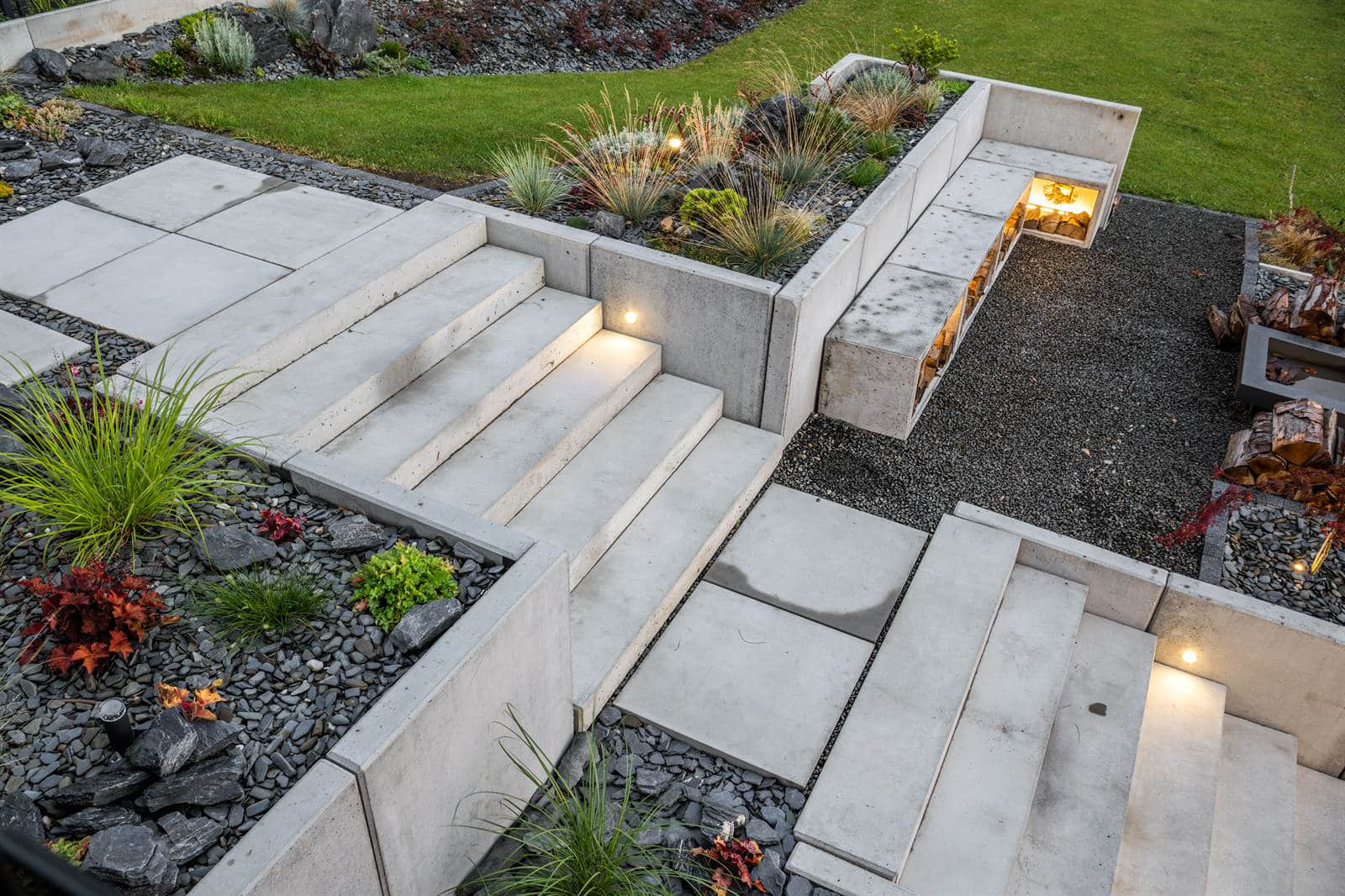 Poured concrete steps, slabs and retaining walls with integrated step lighting